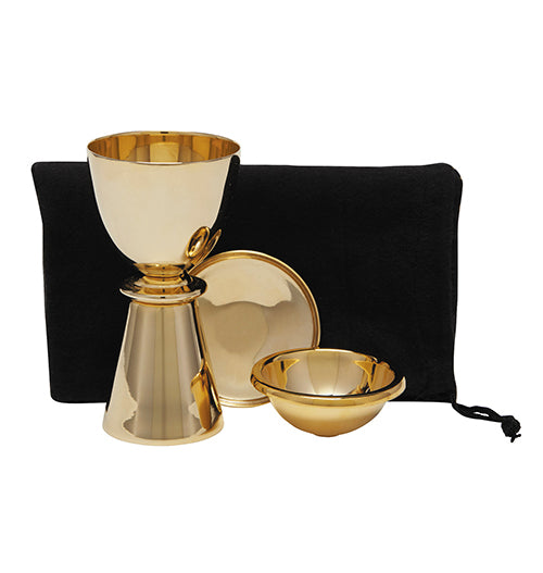 A travel set consisting of a brass chalice with a host bowl and lid, a carrying bag, and a host bowl placed inside the chalice.