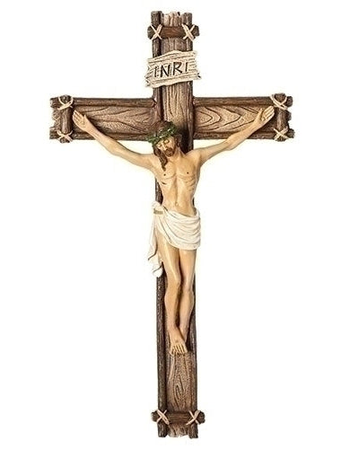 A wooden-like crucifix featuring a figure of Jesus Christ on the cross with the inscription 'INRI' above.