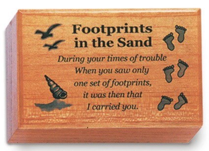 A wooden keepsake box with a message about footprints and a seagull on it.
