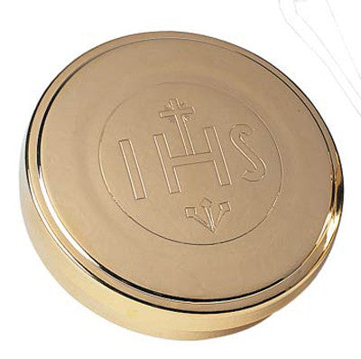 Gold plated circular host box with IHS design and a cross on the top.