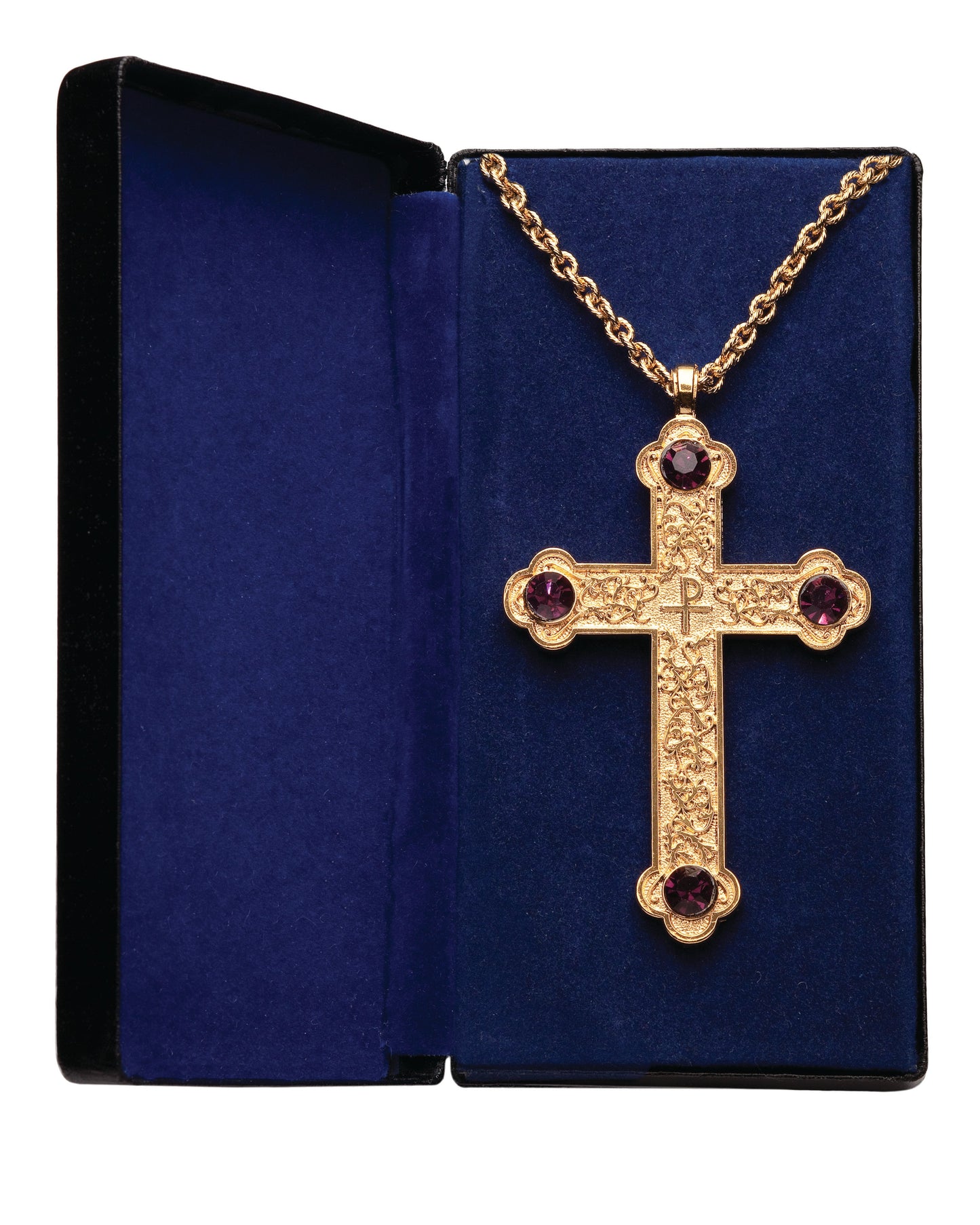 A gold-plated pectoral cross with scroll design and amethyst stones, displayed in a blue gift box.