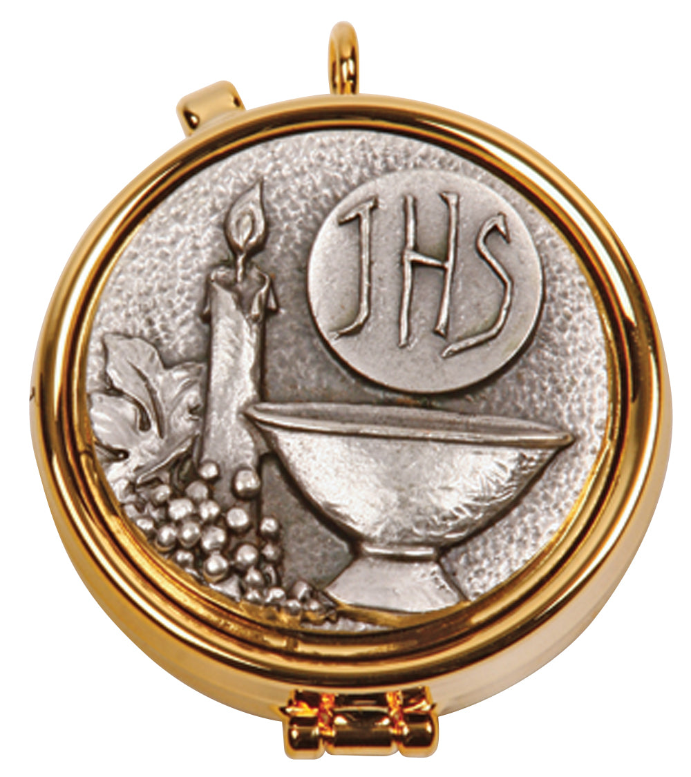 Gold plated silver medallion with a relief design of a chalice, host, and candle, featuring the text 'JHS' for Jesus Host