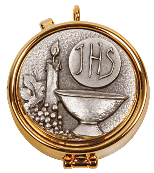 Gold plated silver medallion with a relief design of a chalice, host, and candle, featuring the text 'JHS' for Jesus Host