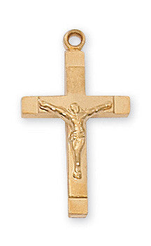 A gold over sterling silver crucifix pendant with a figure of Jesus Christ on a cross, against a plain background.