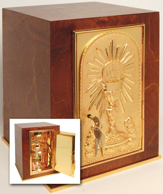 A wooden tabernacle with a 24k gold plate on the door, base frame, and interior. It features gold-plated artwork depicting religious iconography.