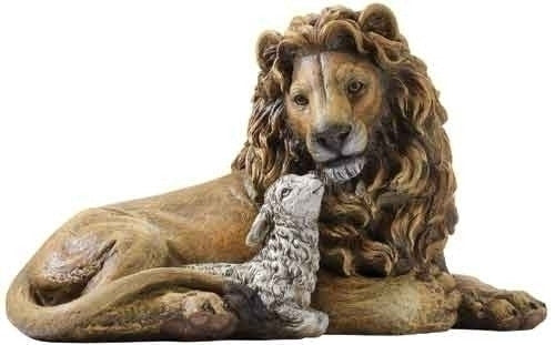A statue of a lion lying down next to a lamb, representing the nativity scene, made of resin stone mix.