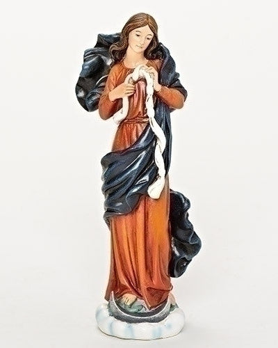 A statue of the Virgin Mary with brown, blue, and white robes standing on a circular base.