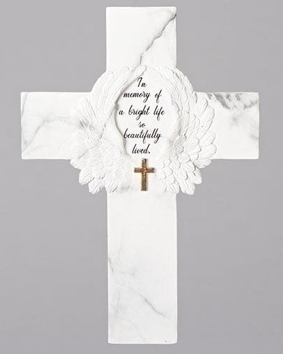 A white marble memorial cross with a crossword-like design in the center, featuring text that reads 'To the Memory of a Bright Life So Beautifully Loved'.