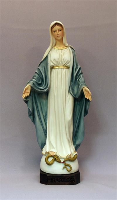 A statue of Our Lady of Grace wearing a blue robe with gold highlights, standing on a wooden base.