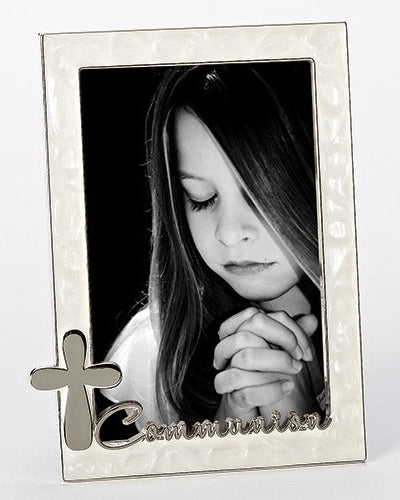 A silver-colored metal photo frame with a pearl-like border, featuring a cross and the word 'communion' at the bottom. It has an easel backing and a hanging hook.