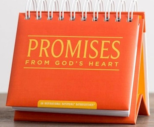 A standing perpetual flip calendar with 'Promises from God's Heart' written on the front, featuring a spiral binding and orange color theme.