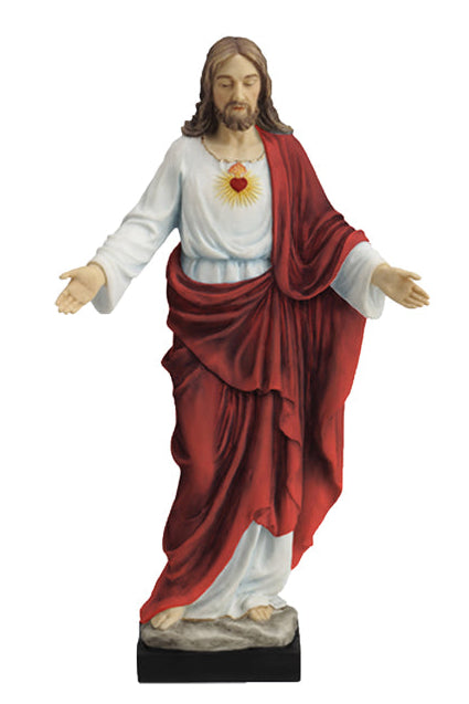 A hand-painted multicolored statue of Jesus Christ, 10 inches in height.