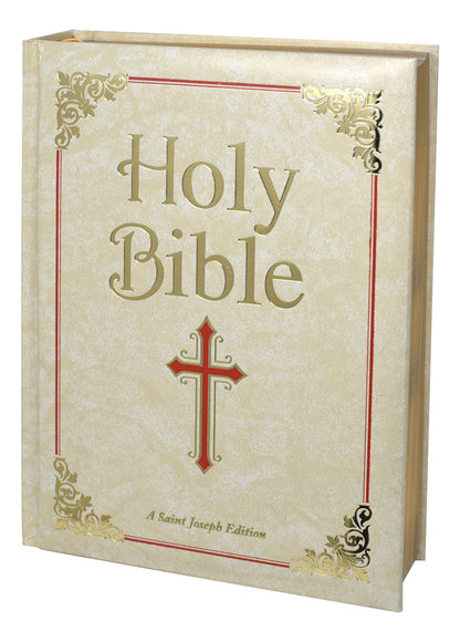 A Saint Joseph Edition Holy Bible with a cream-colored cover featuring a red cross and gold page edging.