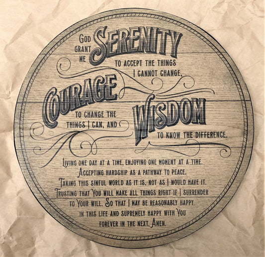 A round MDF board plaque with a rustic barrel-inspired design and copper-colored metal edging. It features the Serenity Prayer in a cursive font.