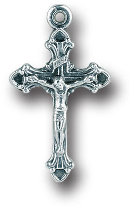 A silver oxidized metal crucifix with a loop at the top, approximately 0.75 inches in size.