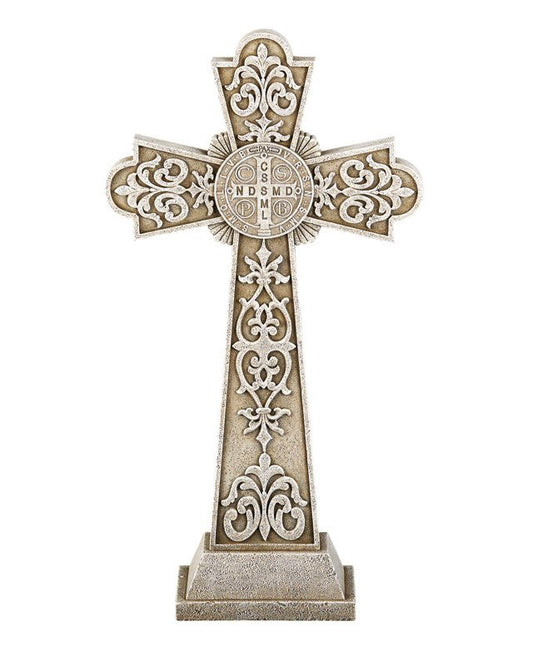 A beige and brown Saint Benedict Garden Cross made of stone resin, featuring intricate designs and the iconic medal with the image of St. Benedict on one side.