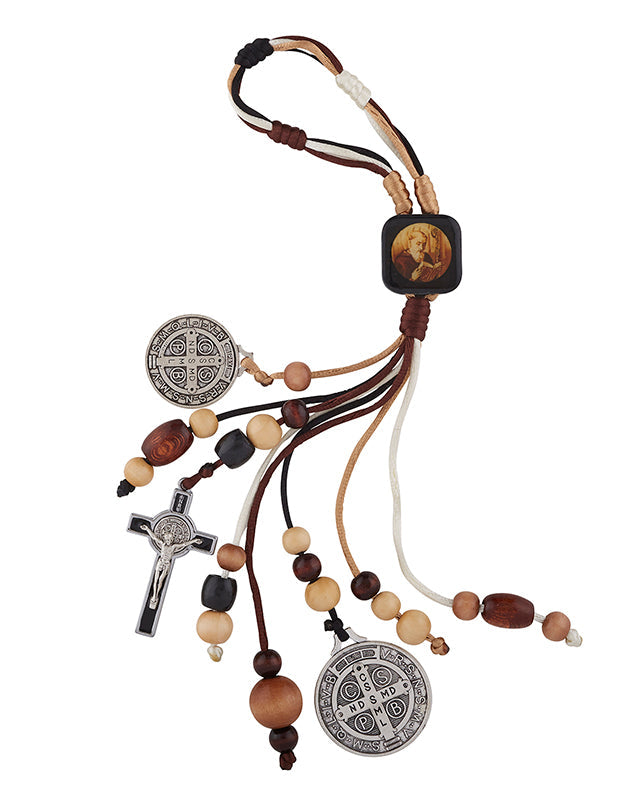 A St. Benedict Home Blessing Door Hanger featuring a metal centerpiece with an image of St.