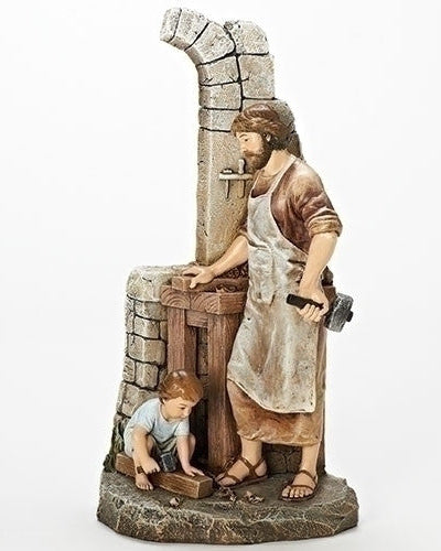 A statue of St. Joseph the Carpenter with a young boy at his side, both depicted in a realistic style with detailed clothing and expressions.