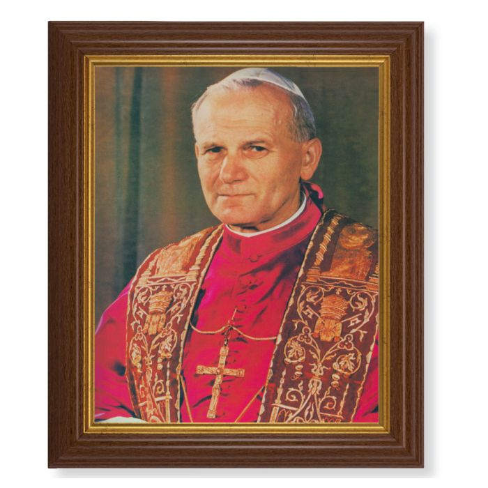 A framed print of Saint Pope John Paul II wearing his papal vestments, in a dark walnut frame with a gold beaded lip.