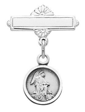 A sterling silver pin featuring a baby angel figure on a round base with a decorative floral design above. The pin has a clip for attaching to clothing.