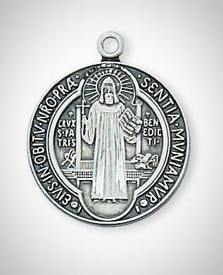 A sterling silver pendant featuring the figure of St. Benedict with inscriptions around the edge.