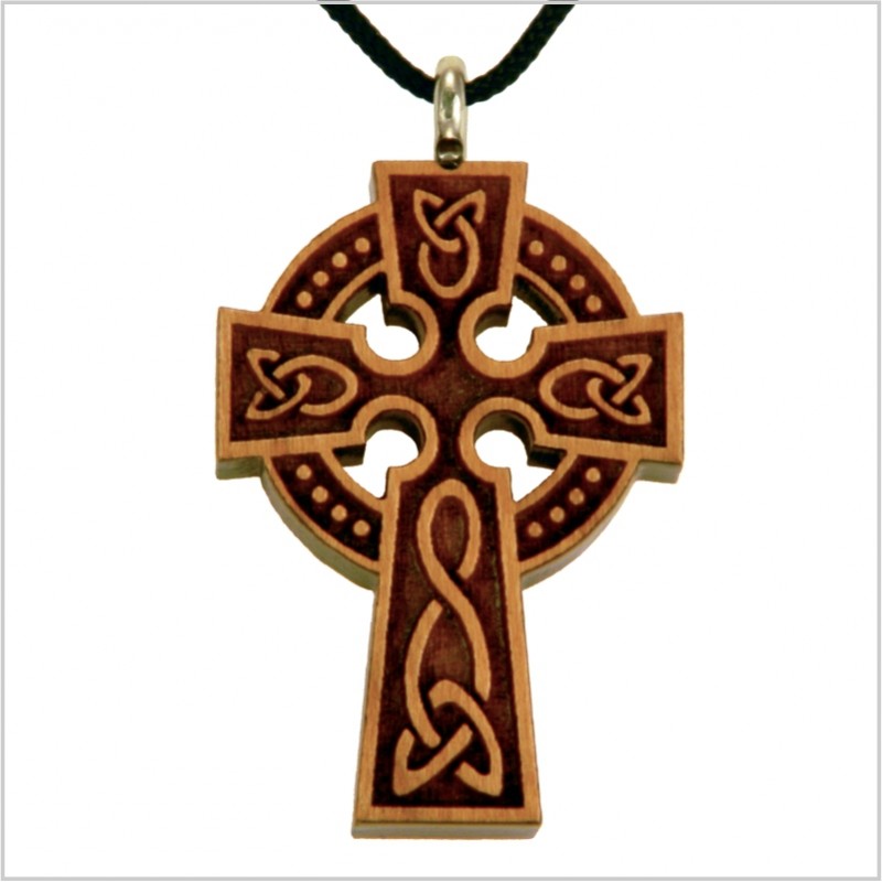 A wooden celtic cross necklace with a glossy finish, featuring intricate engravings and a laser-cut design. The necklace is attached to a black cord.